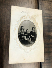 Load image into Gallery viewer, 1860s tintype three id'd girls on embossed mount with note + dated april 1867