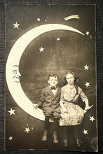Load image into Gallery viewer, Kids Sitting On Paper Prop Moon 1910s Antique Photo RPPC Vintage
