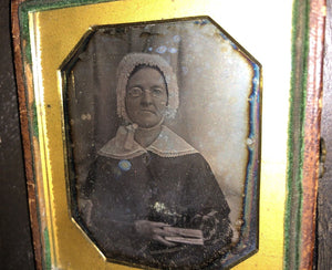 early 1840s daguerreotype woman wearing eyeglass holding book scovills plate
