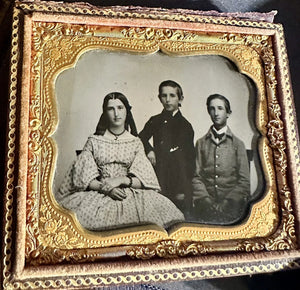 Sixth-plate ambrotype of three children, identified inside of the case. Very good or better antique condition in half of its original case.