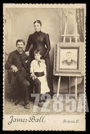 Family Posing with Memorial Portrait by JAMES BALL Ohio Photographer Mourning