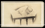 1860s Post Mortem Photo - Little Girl in Crib Holding Tiniest Doll