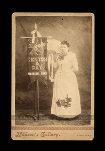 Machine Shop Banner Lady with Rare Fire Engine Pumper on Dress / Tama Iowa
