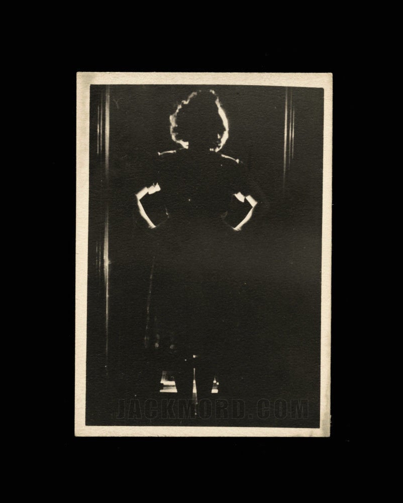 vintage artistic snapshot photo - ominous shadow woman in doorway