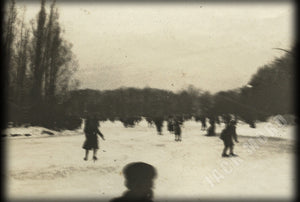 dreamy surreal ice skater silhouettes on frozen pond antique snapshot photo