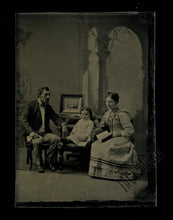 Load image into Gallery viewer, 1800s tintype family with framed photo of 4 people mourning or memorial scene?
