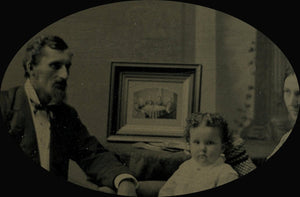 1800s tintype family with framed photo of 4 people mourning or memorial scene?