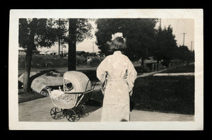 snapshot photo girl turned away from camera with doll stroller, unusual creepy
