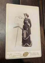 Load image into Gallery viewer, Banner Lady Cabinet Card - Decorated Dress &amp; Holding Lumber Sign
