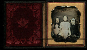 tinted daguerreotype woman & daughters, older with long ringlet curls in hair